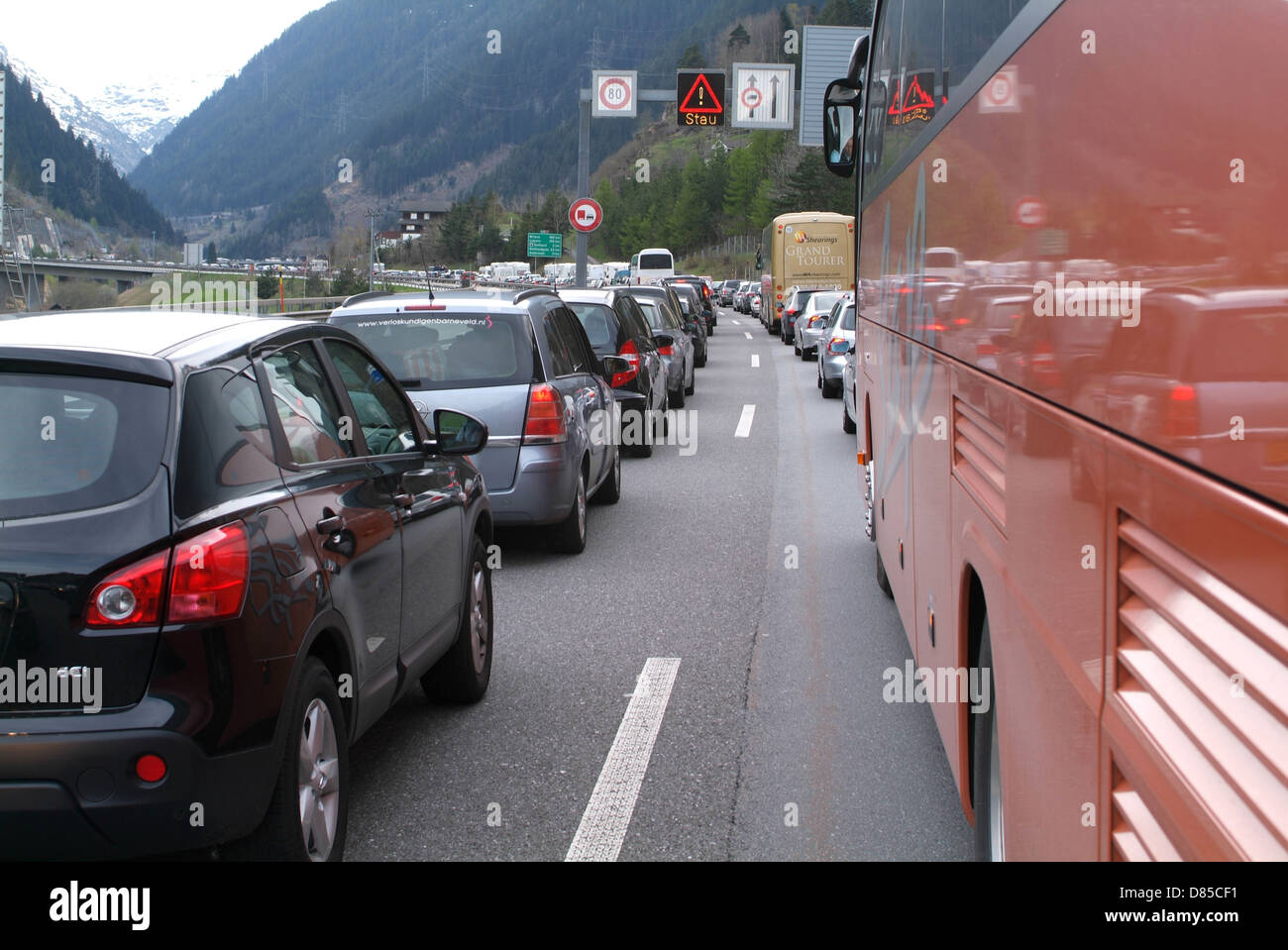 Traffic jam at the highway to tunnel mount Gotthard on the Swiss alps ...