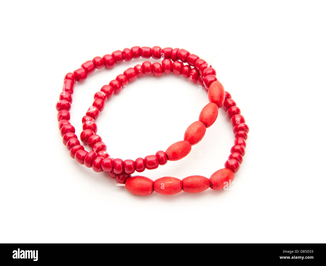 children's red bracelets isolated on white background Stock Photo