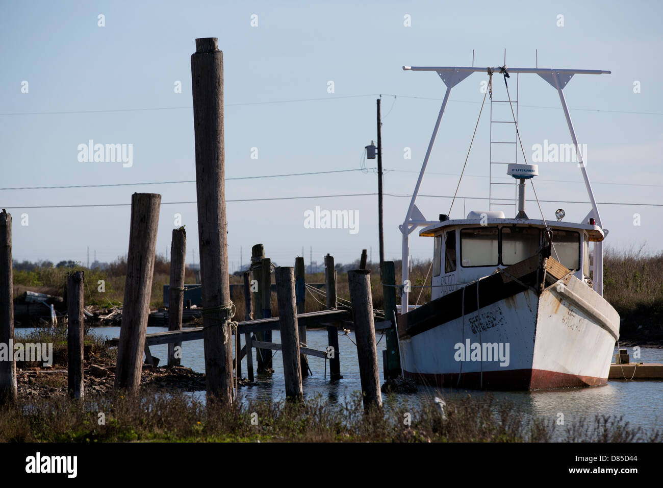 Old rusty shrimp boat tied to a pier in Galveston, Texas Stock Photo