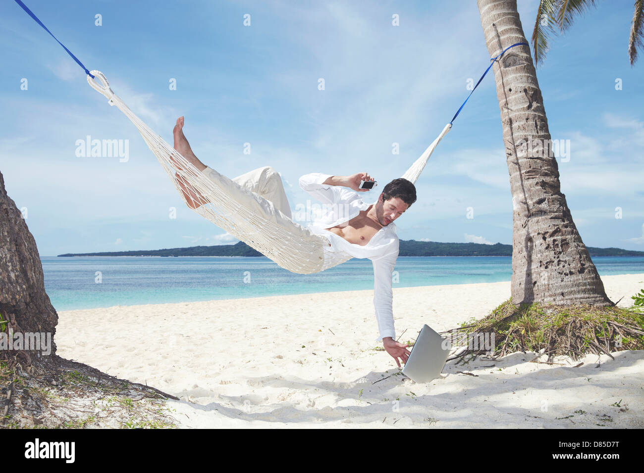 man lying in hammock laptop Stock Photo Alamy