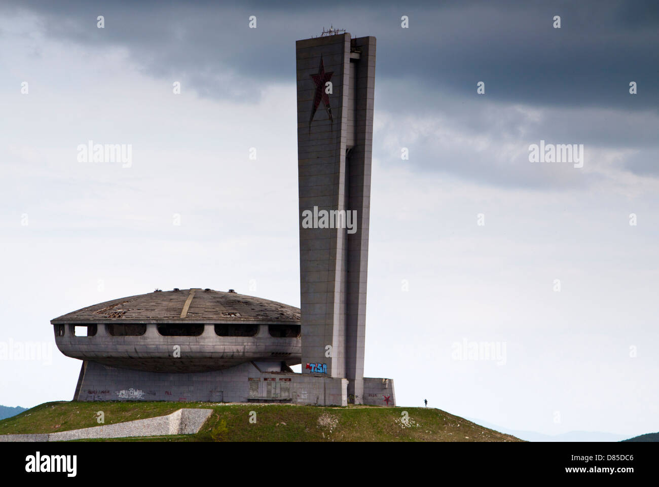 Dark clouds over the communist-era Buzludzha monument in central Bulgaria Stock Photo