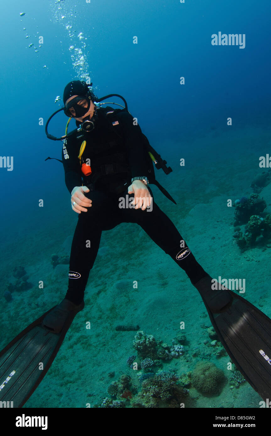 A scuba diver poses for the camera Photographed in the red sea Aqaba, Jordan Stock Photo