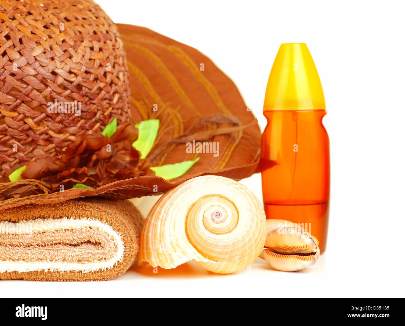 Beach items isolated on white background, straw hat, sunscreen oil