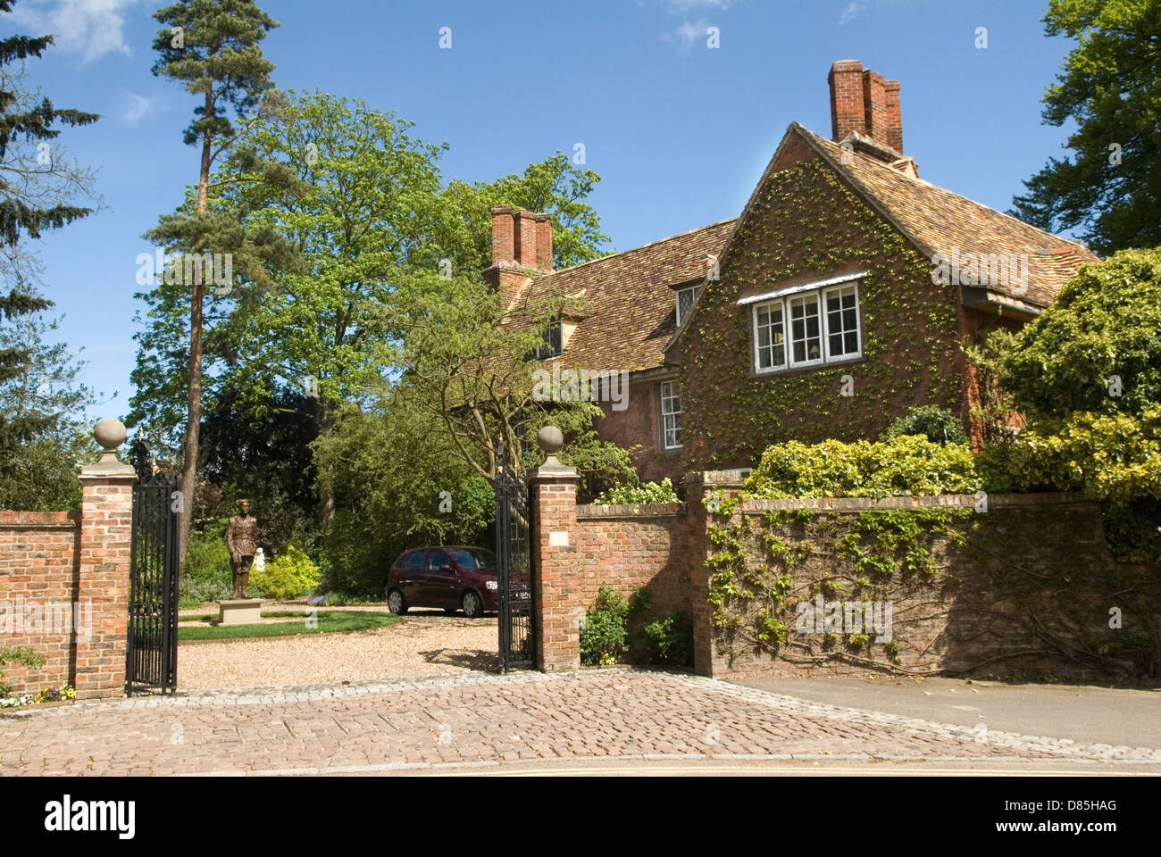 Grantchester Cambridgeshire, UK. The Old Vicarage home of Jeffrey and Mary Archer. English poet Rupert Brooke  statue now stands in the front drive. 2013 2010s HOMER SYKES Stock Photo