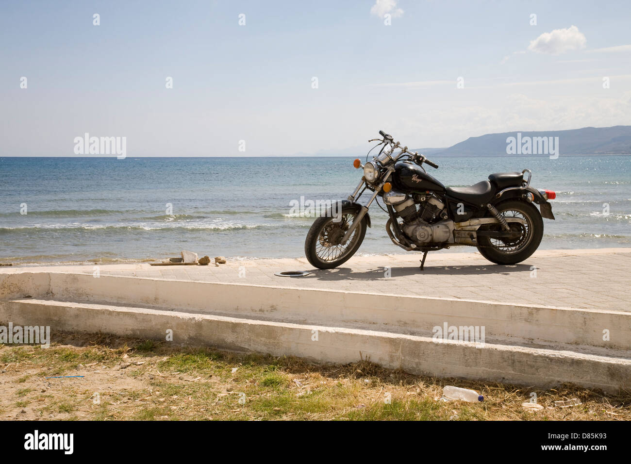 Motorbike next to the sea at Georgioupoli, Crete, Greece. Stock Photo