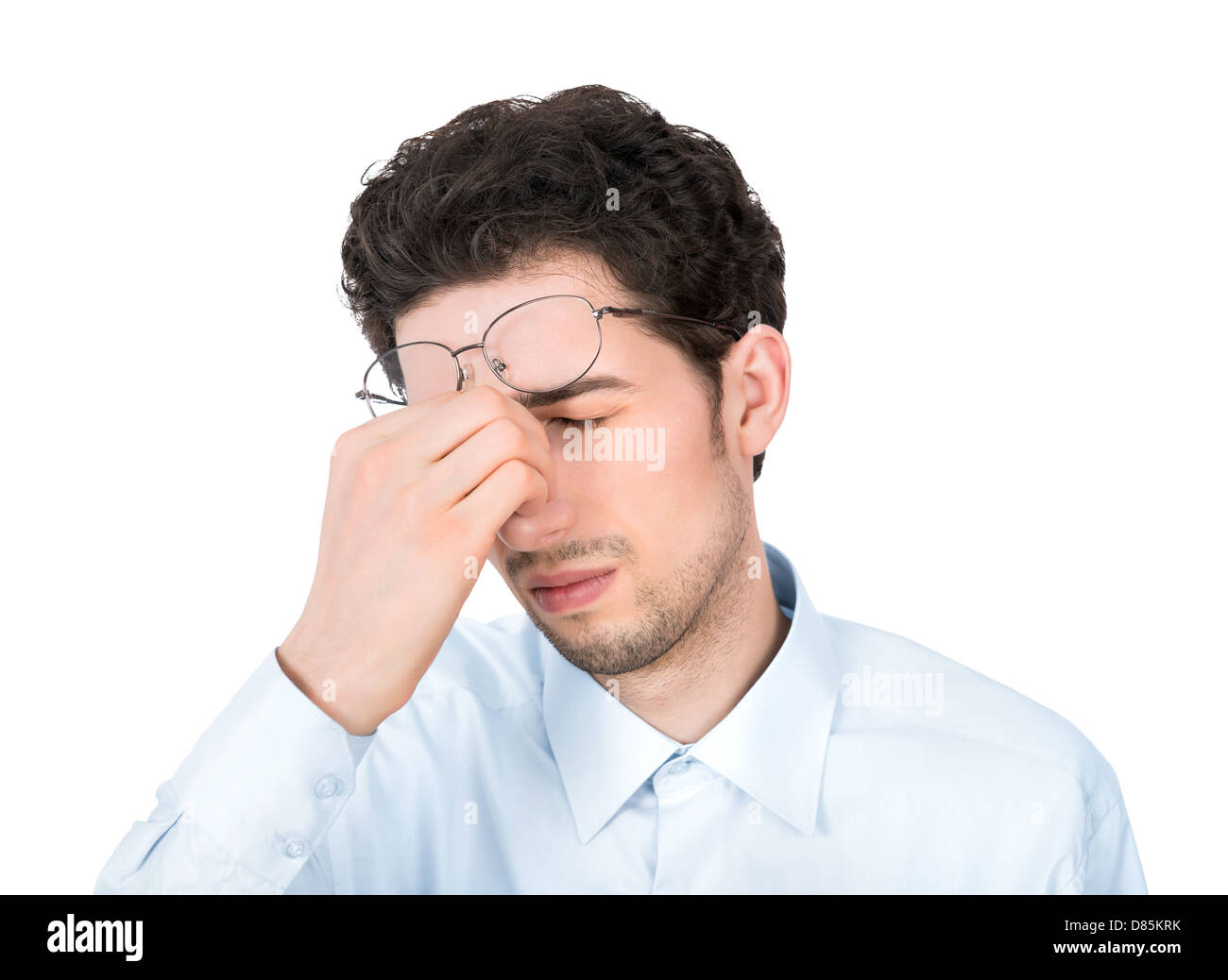 Handsome young businessman showing tired or headache gesture. Isolated on white background. Stock Photo