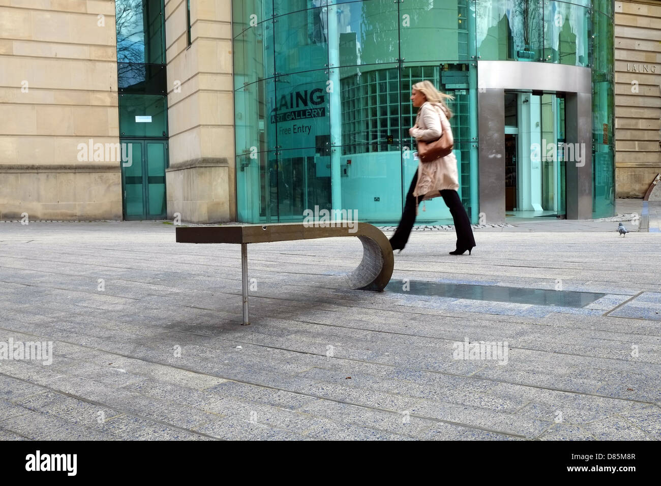 A woman walking past the Laing Art Gallery in the centre of Newcastle