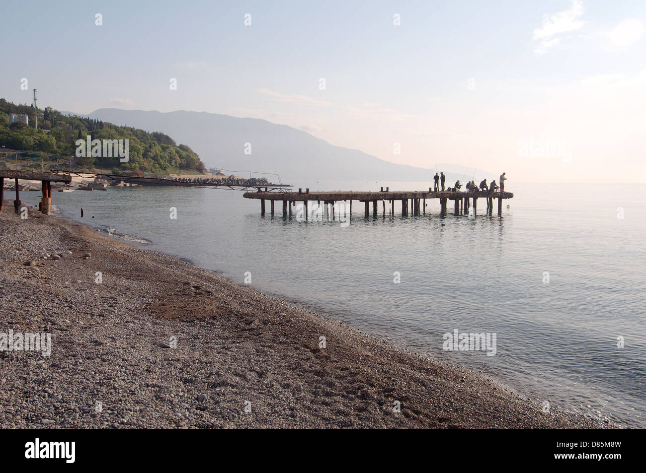 Fishermen catch fish on the pier, The Greater Yalta, Crimea, Ukraine, Eastern Europe Stock Photo