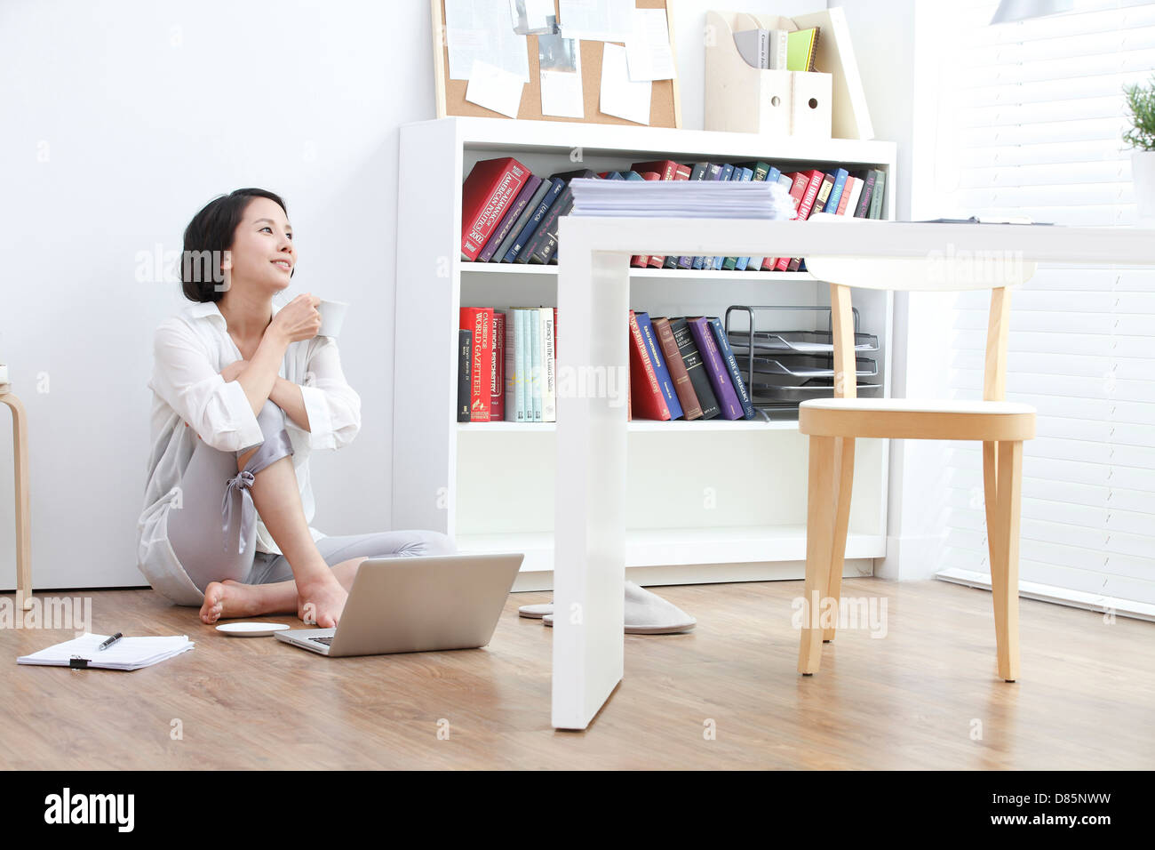 young woman sitting on floor laptop computer Stock Photo - Alamy