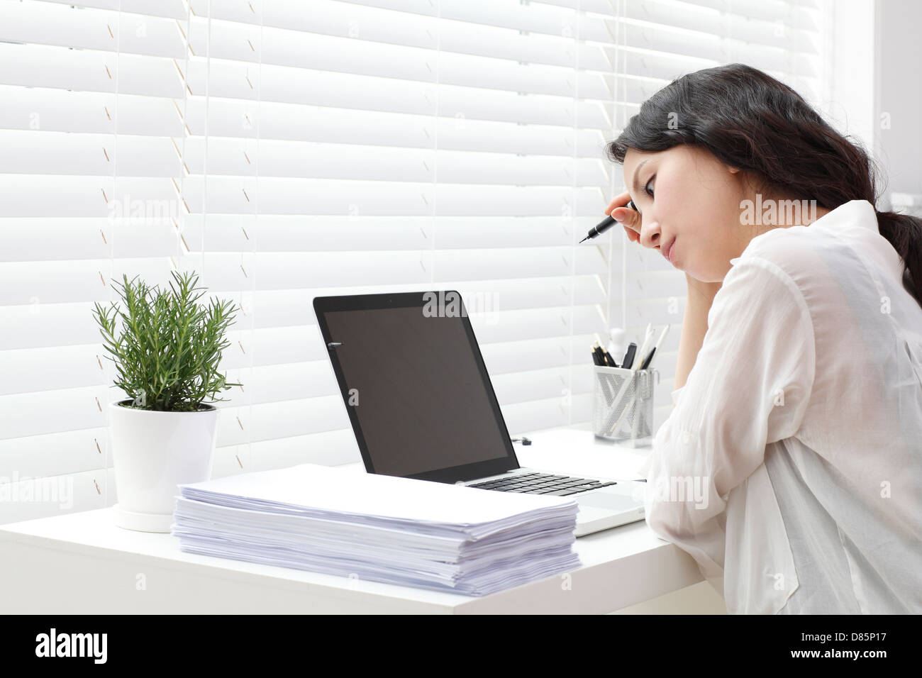 young woman sitting desk computer. Stock Photo