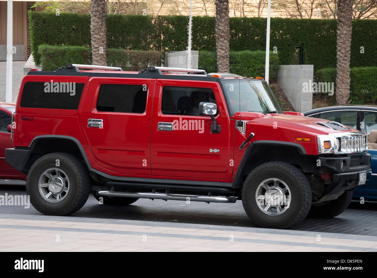 Bright Red Hummer H2 Luxury Sports Utility Vehicle Stock Photo