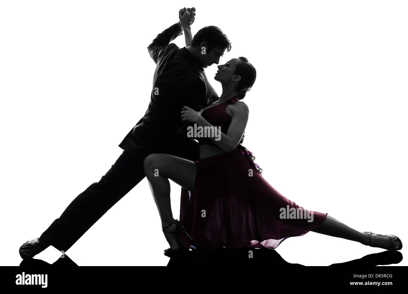One Couple Man Woman Ballroom Dancers Tangoing In Silhouette