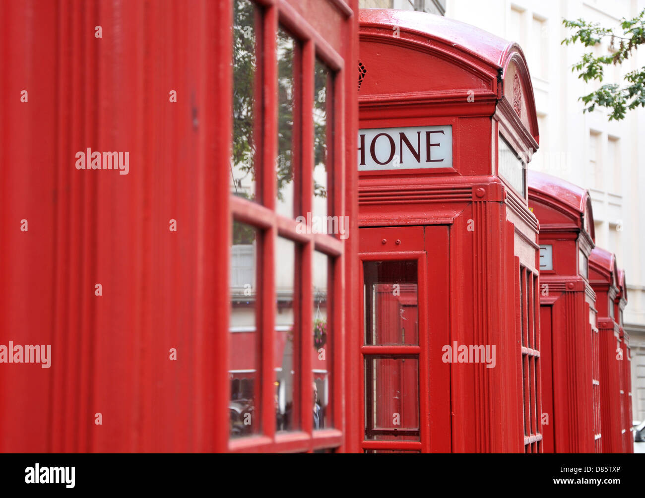 Old style red British telephone boxes.. Stock Photo
