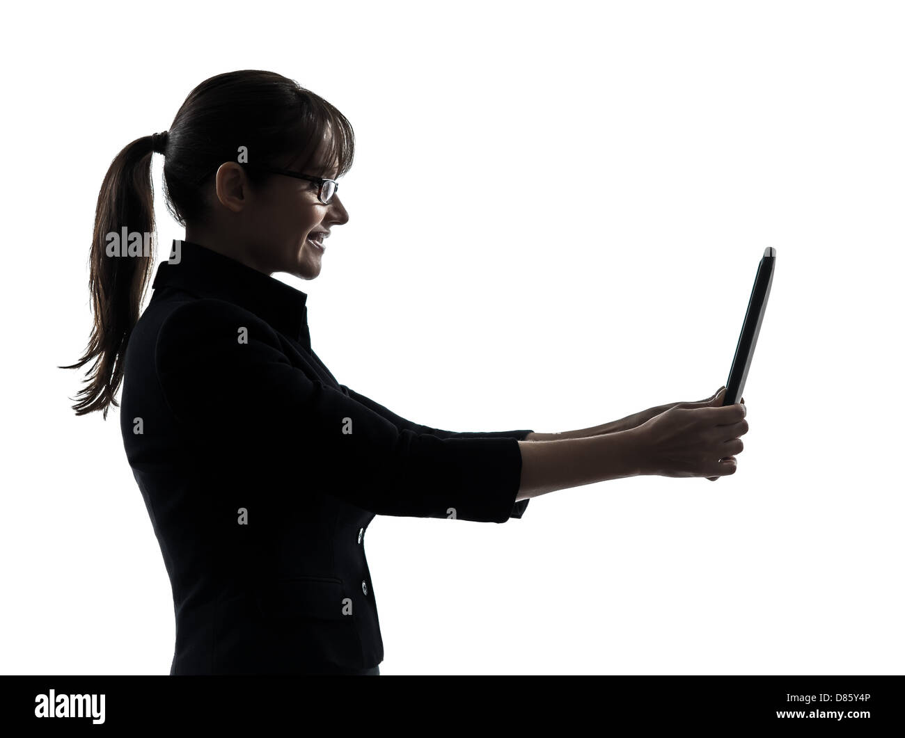 one business woman computer computing digital tablet silhouette studio isolated on white background Stock Photo