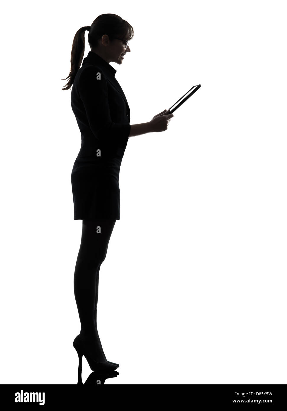 one business woman computer computing digital tablet silhouette studio isolated on white background Stock Photo