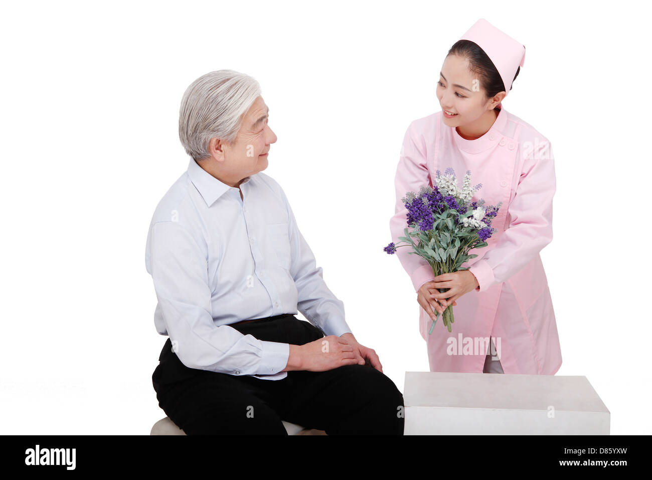 The nurse gave flowers to the patient Stock Photo Alamy
