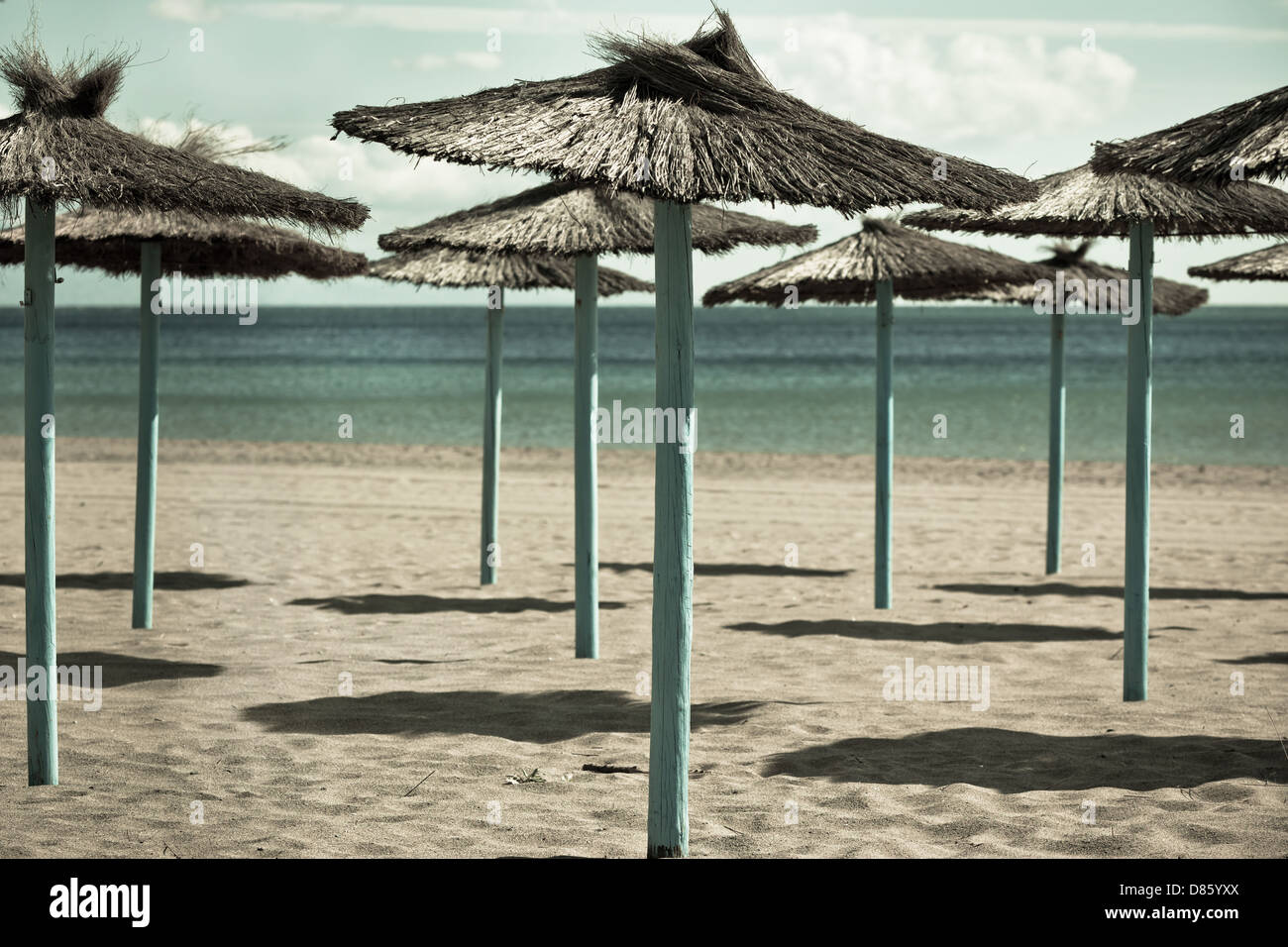 Line of Parasols at Spanish Sand Beach. Horizontal shot Stock Photo Alamy