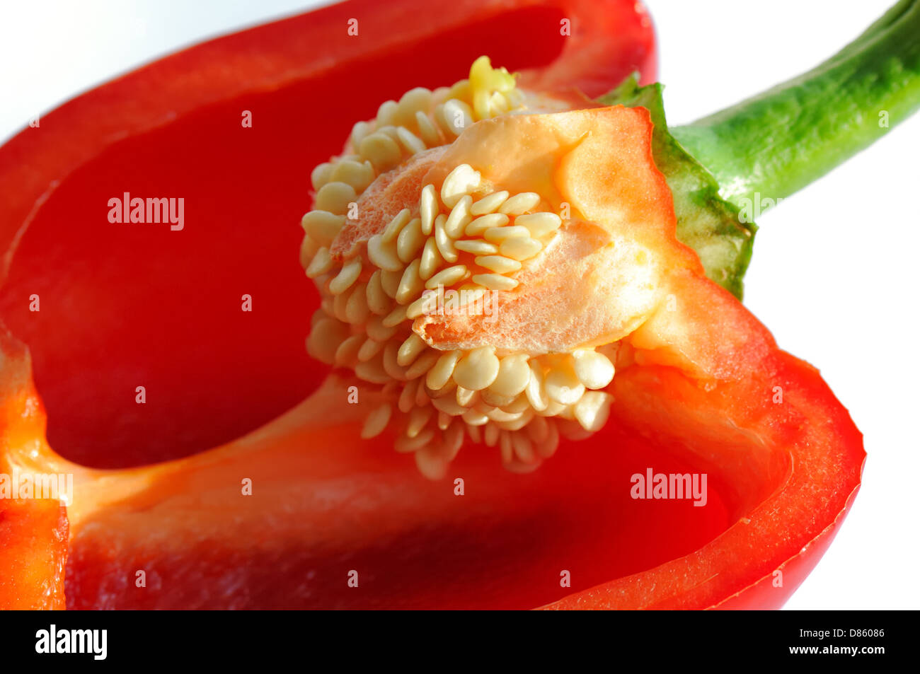 Half a red pepper close up showing seeds Stock Photo