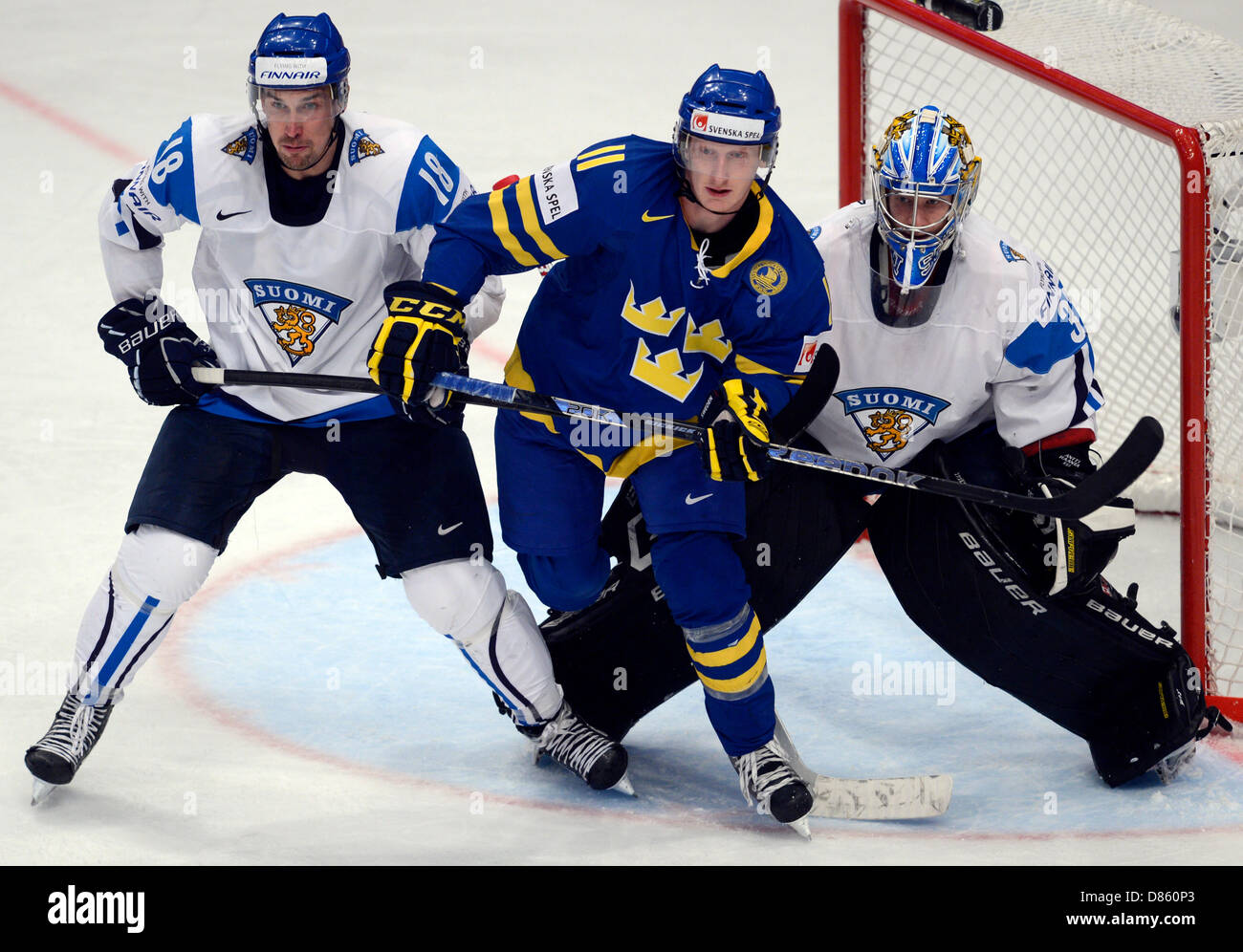 IIHF World Championships, Ice Hockey, semifinal match Sweden vs. Finland, May 18, 2013, Stockholm, Sweden. Left to right: Sami Lepisto (FIN), Simon Hjalmarsson (SWE) and goalkeeper Antti Raanta (FIN). (CTK Photo/Vit Simanek) Stock Photo