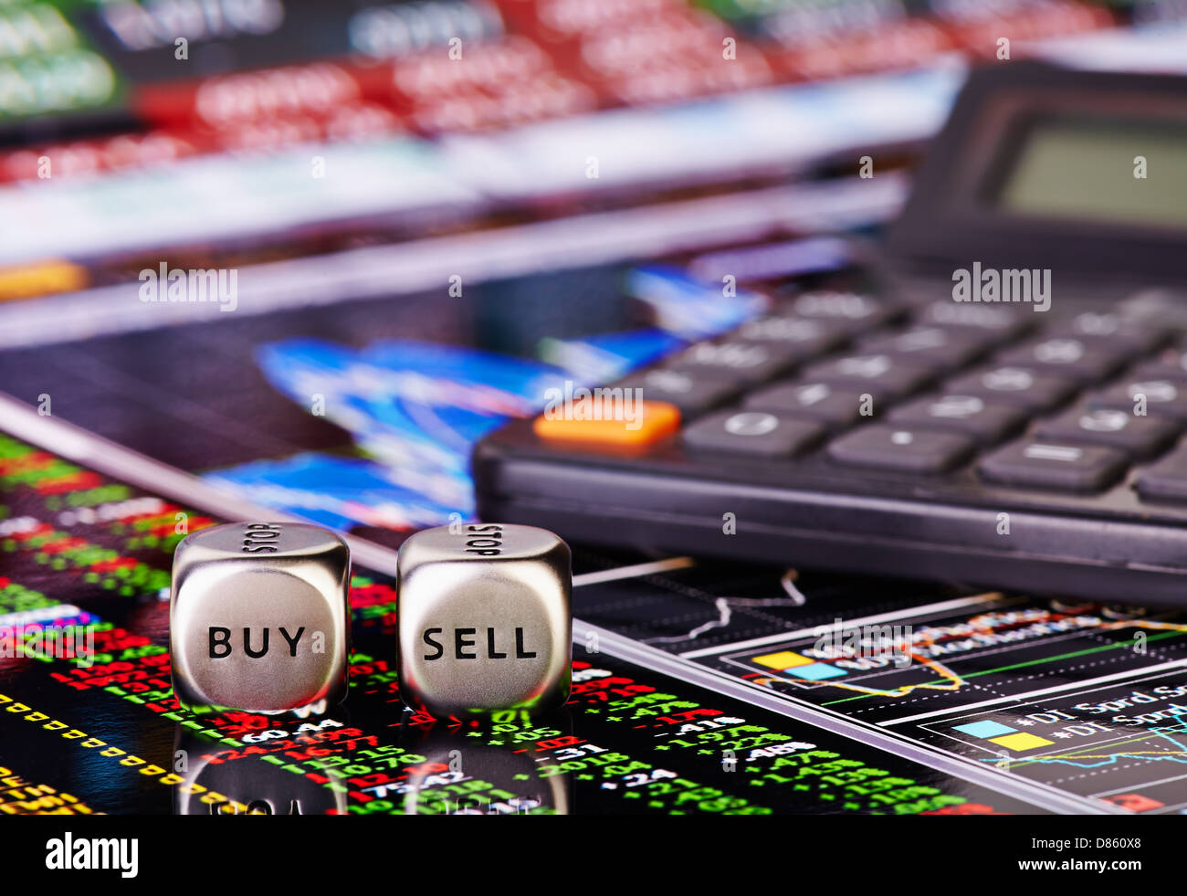 Dices cubes with words SELL BUY for trader and calculator. Financial chart and columns of figures as background. Selective focus Stock Photo