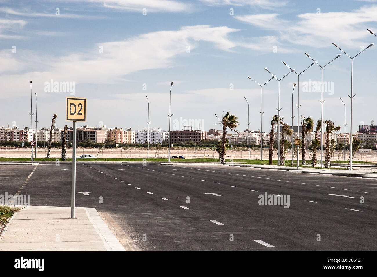 Empty asphalt road with cloudy sky and sunlight Stock Photo - Alamy