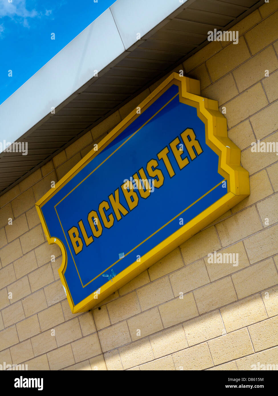 Blockbuster sign ahowing blue and yellow logo outside DVD Blu Ray and games  rental outlet in the UK Stock Photo - Alamy
