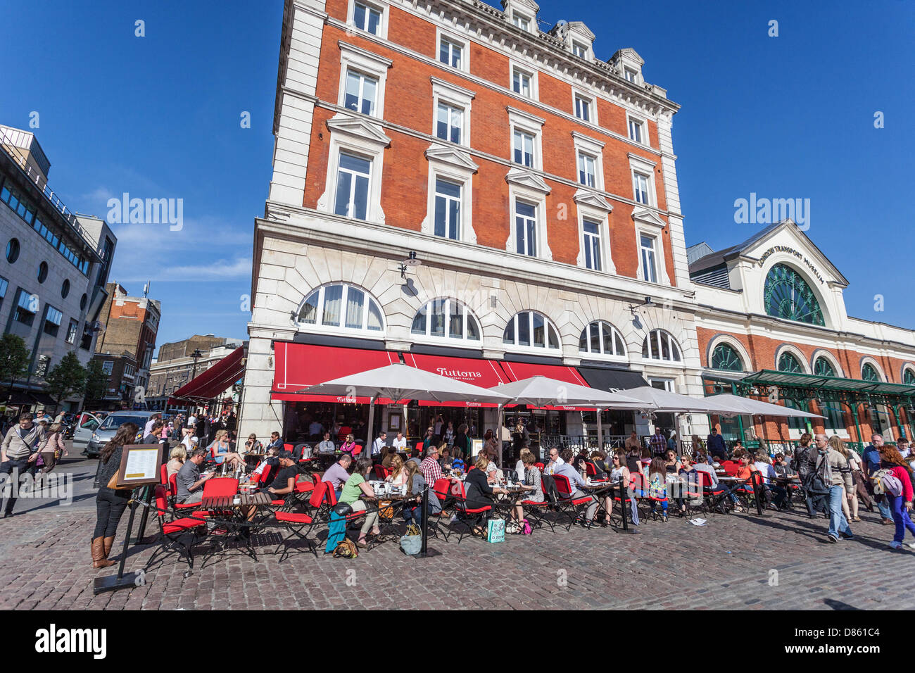 Busy restaurant terrace around Covent Garden Square, London, England, UK Stock Photo