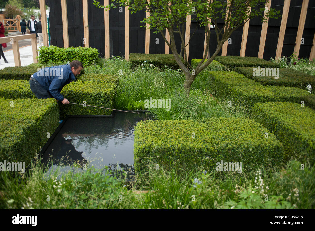 20.5.2013, London, UK. Finishing touches to The Daily Telegraph Garden designed by Christopher Bradley-Hole at the RHS Chelsea Flower Show. Stock Photo