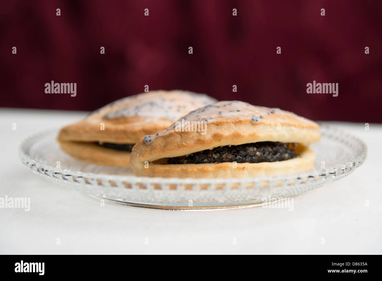 Poppy pastry bag on a glass plate Stock Photo