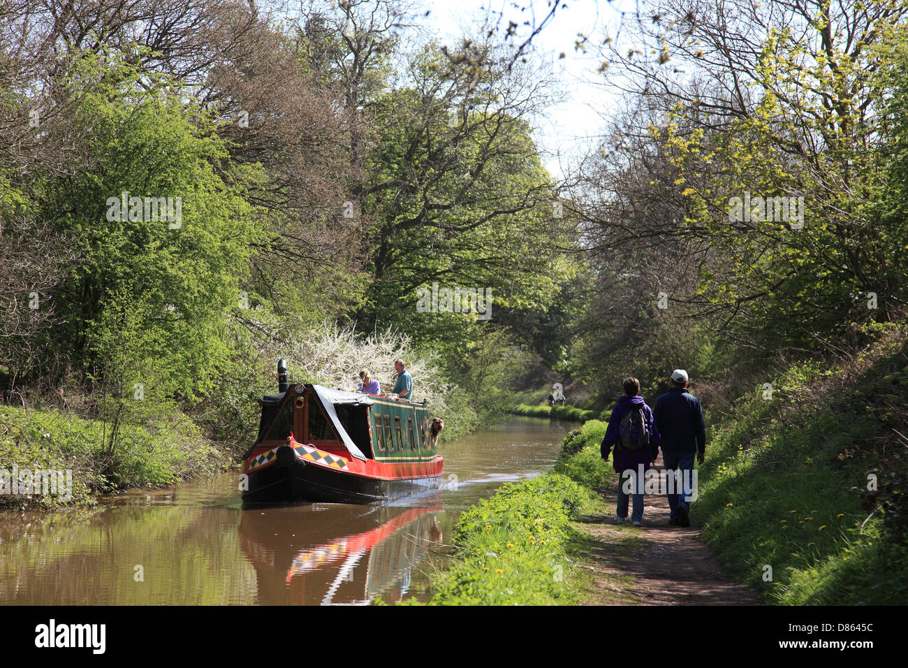 A narrowboat and walkers on the towpath of the Shropshire Union Canal