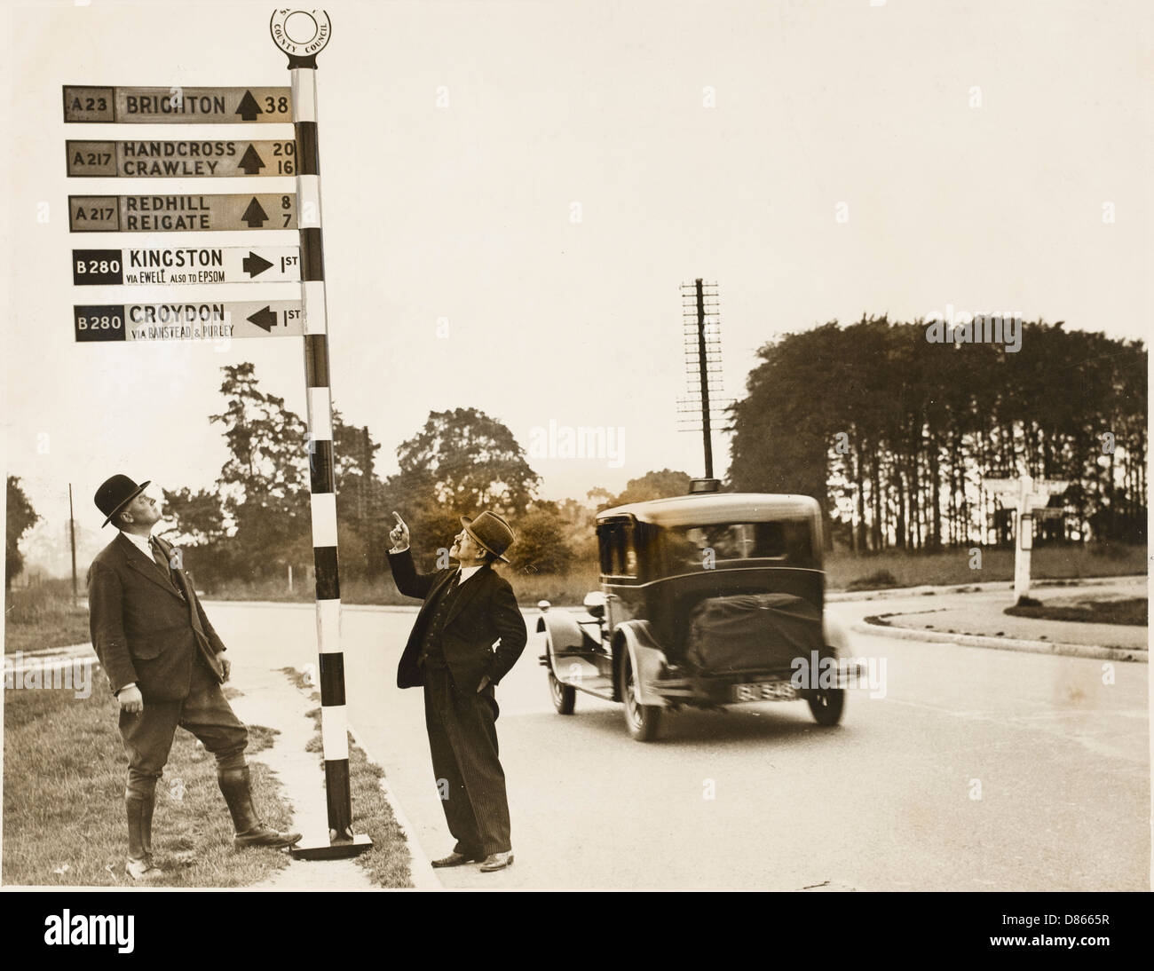 Men and signpost Stock Photo - Alamy
