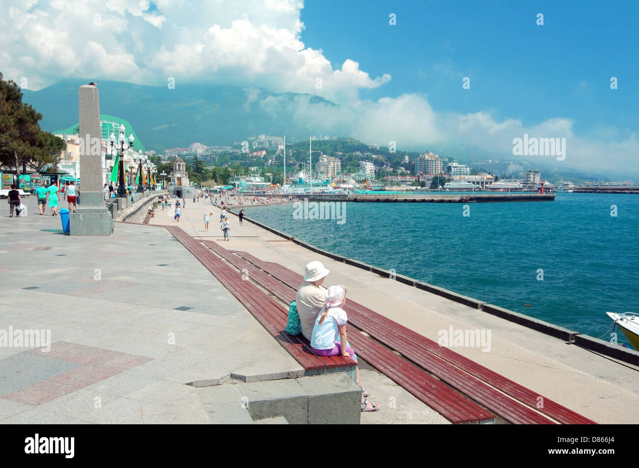 People walk along the promenade at Yalta, Crimea, Ukraine, Eastern Europe Stock Photo