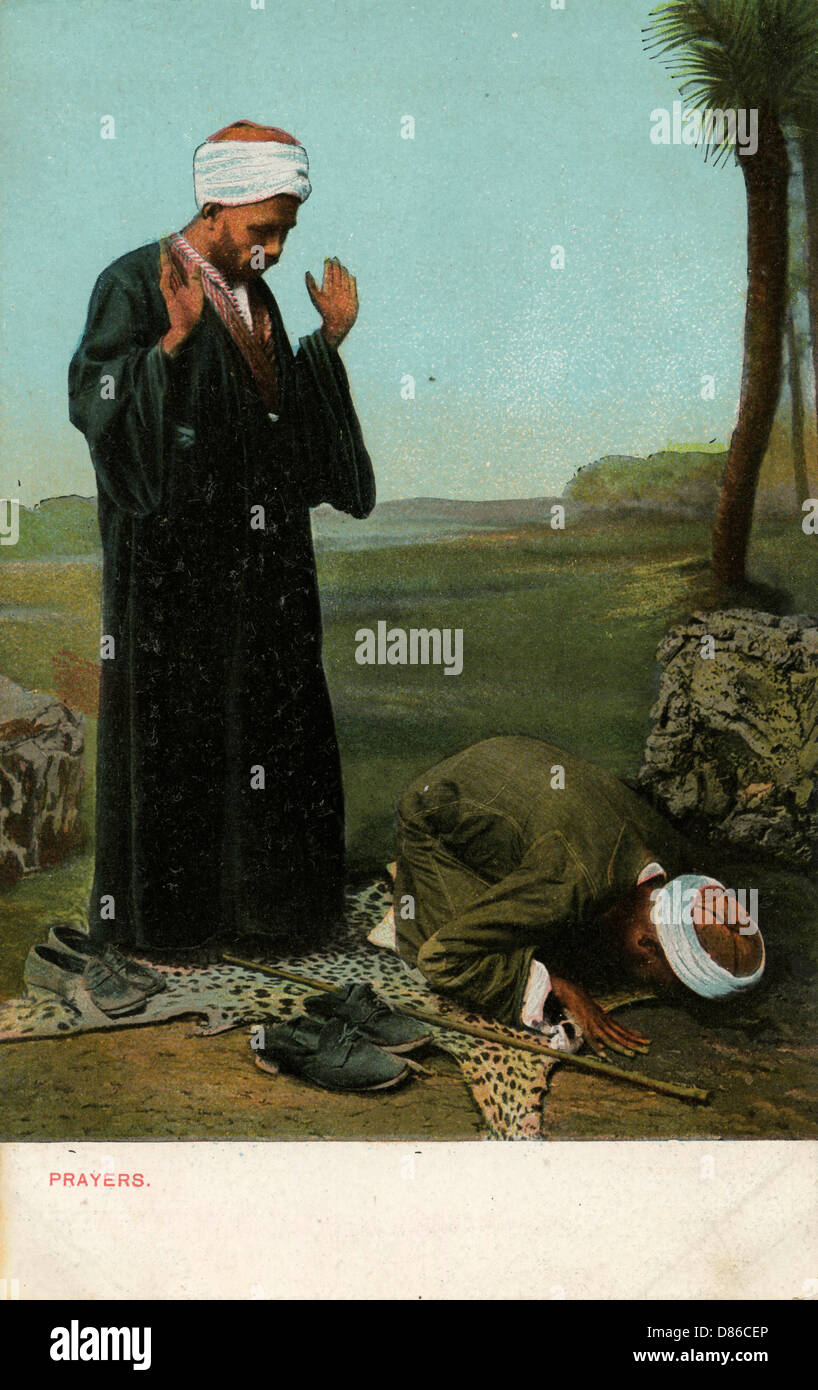 Muslims kneeling in prayer hi-res stock photography and images - Alamy