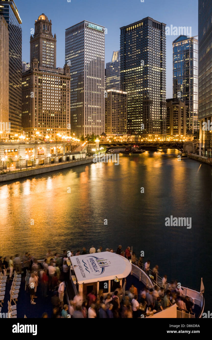 Evening cruise boat on Chicago River and skyscrapers Chicago, Illinois Stock Photo