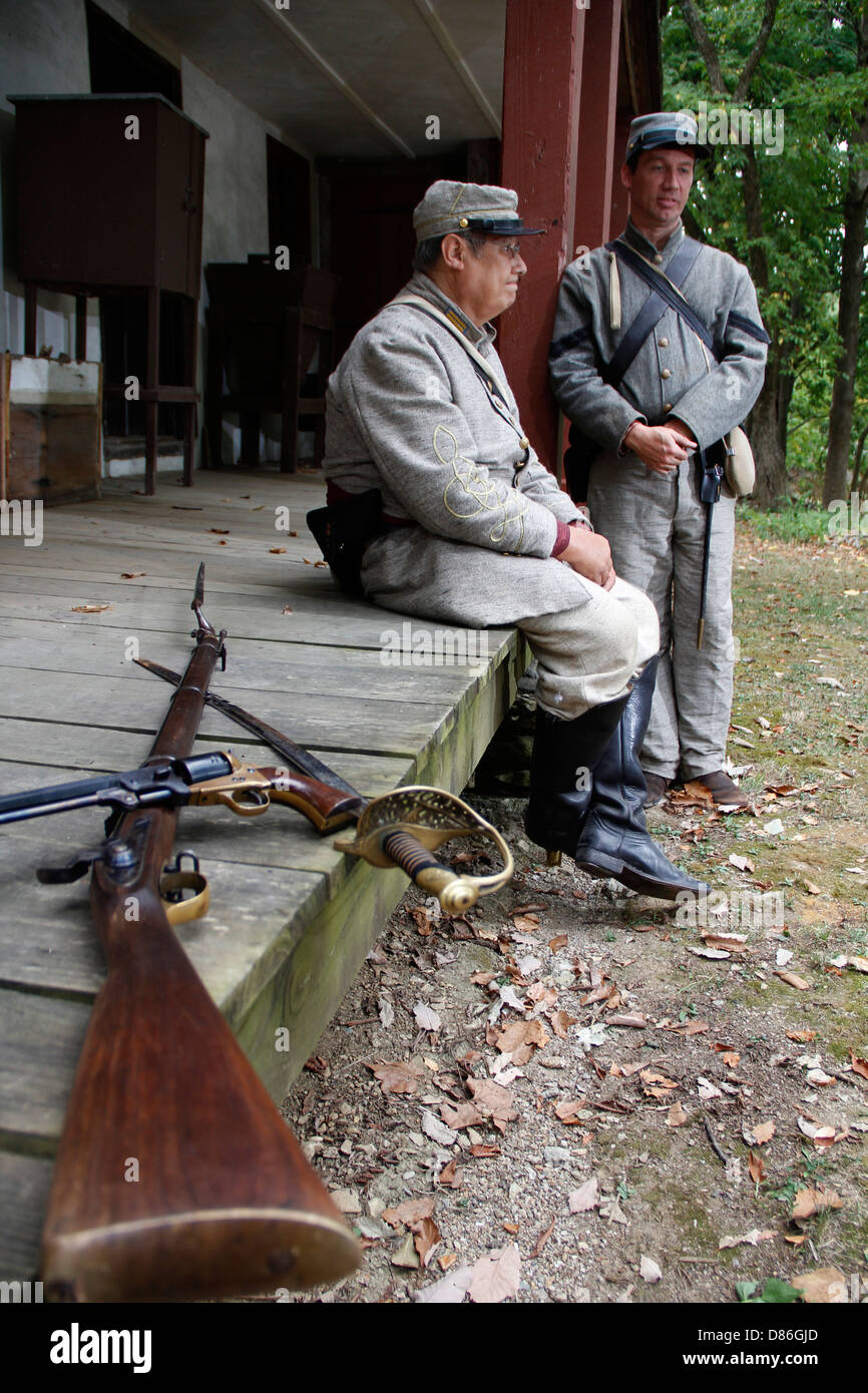 American civil war reenactor in uniform costume near old period