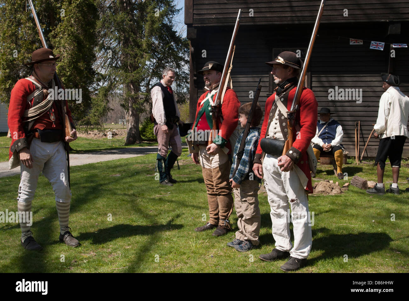 Men and boy reenact practicing to volunteer for the Militia  to fight Revolutionary War in Historic Deerfield Massachusetts. Stock Photo