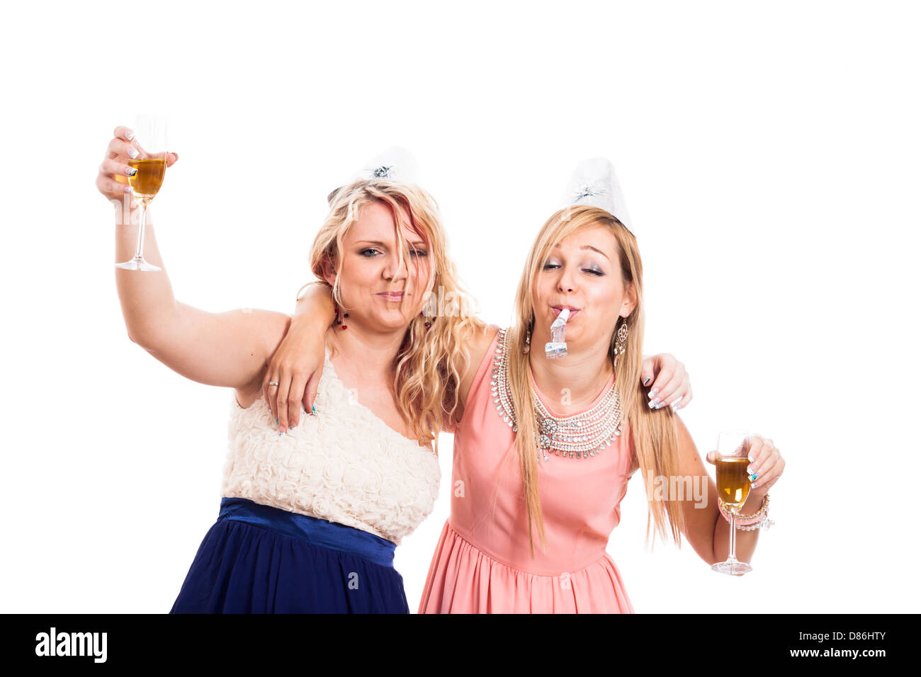 Two drunk girls celebrate with alcohol, isolated on white background Stock Photo