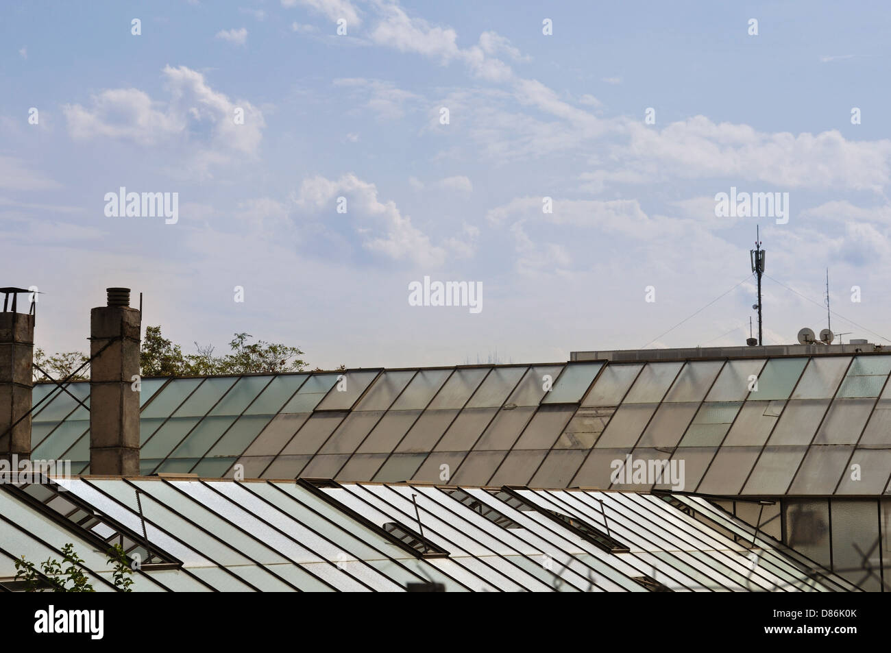 Greenhouse glass roof and cloudy sky. Abstract background Stock Photo