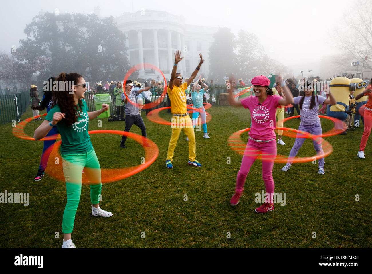 KidTribe hula hoopers perform during the Easter Egg Roll on the South Lawn of the White House on a foggy day April 1, 2013 in Washington, DC. Stock Photo