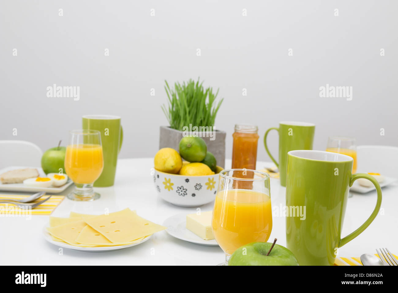 Bright table setting with fresh tasty breakfast Stock Photo - Alamy