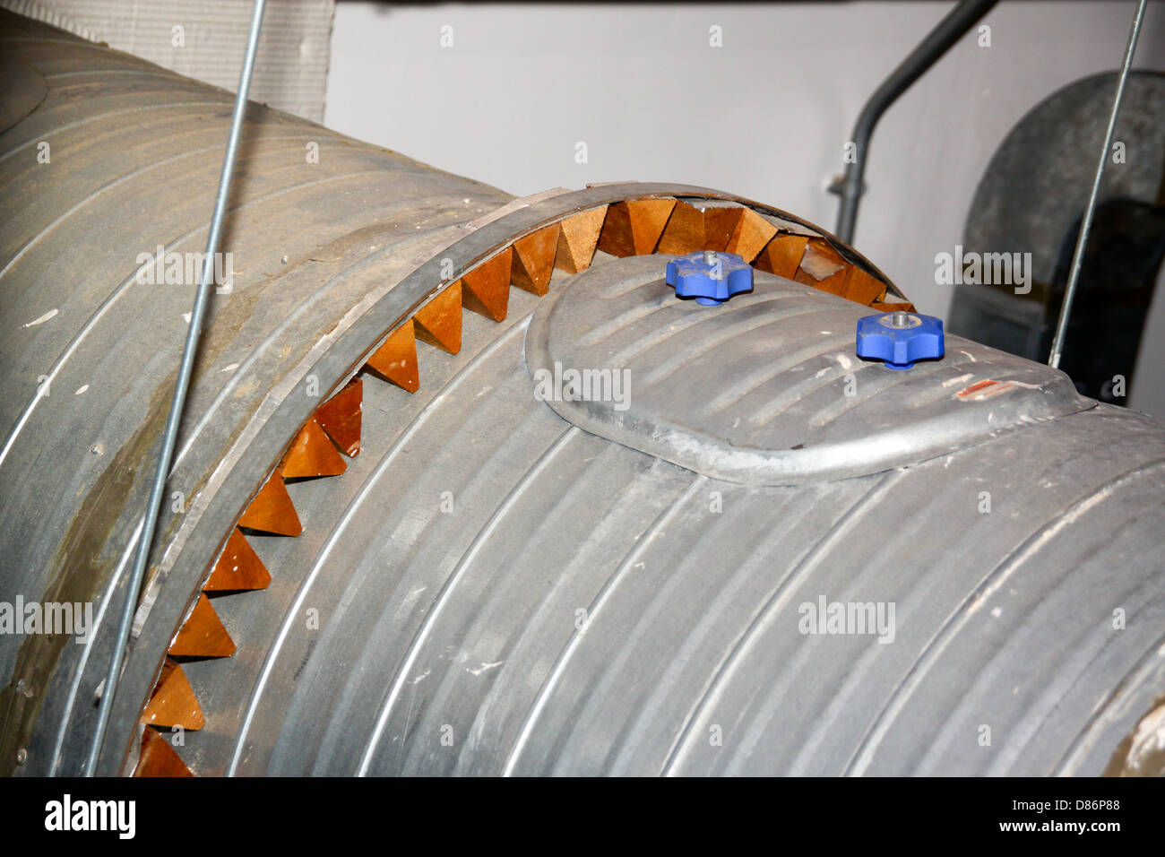 Vibration damping on large air duct within building plant room Stock Photo