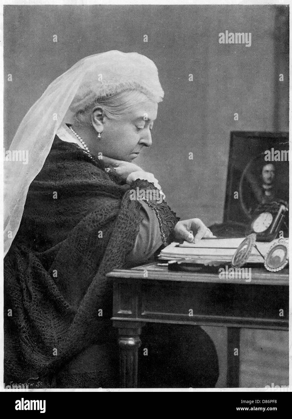 Queen Victoria seated at a desk Stock Photo Alamy