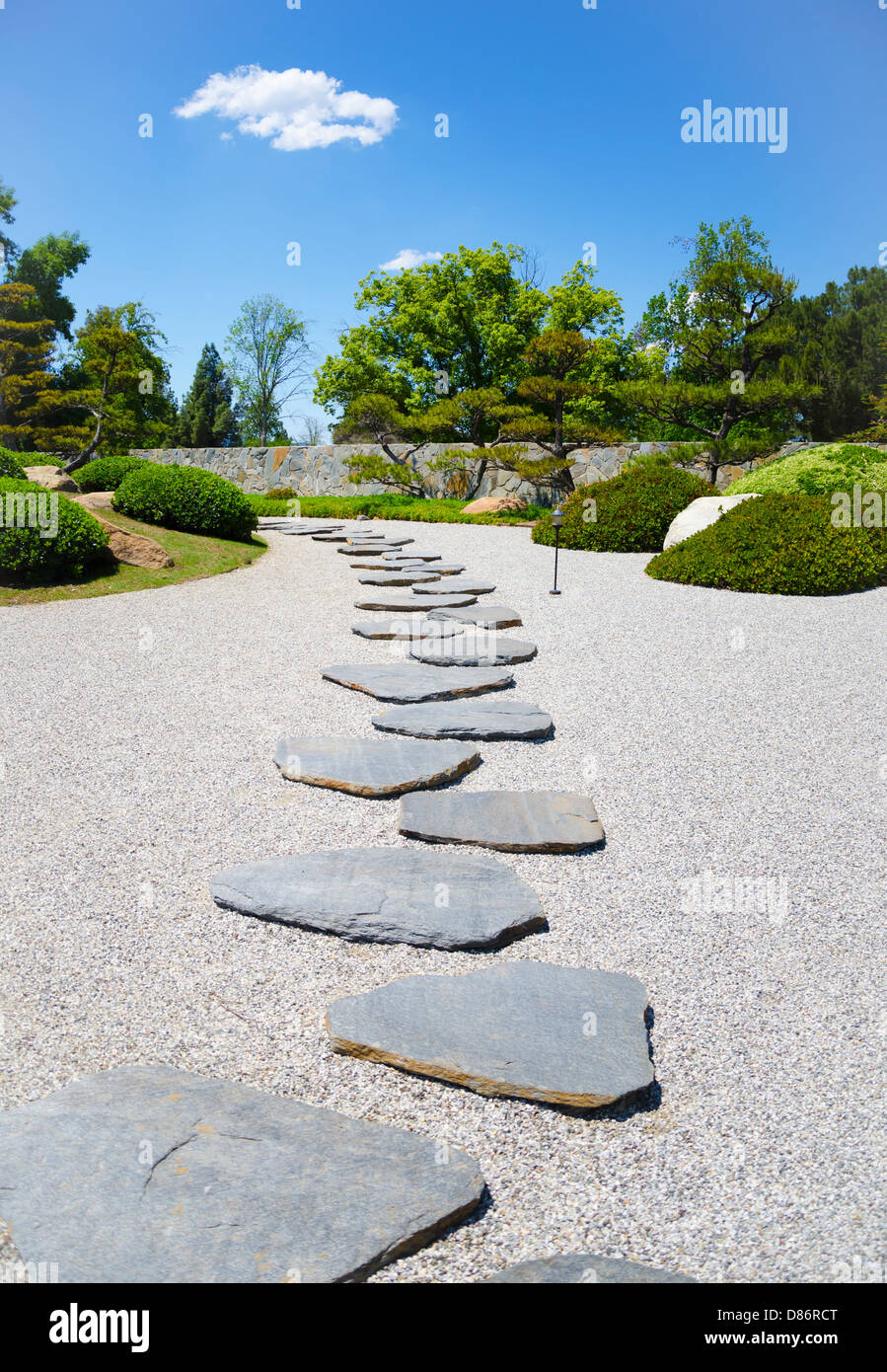 Stone's way in the Japanese garden in sunny day Stock Photo