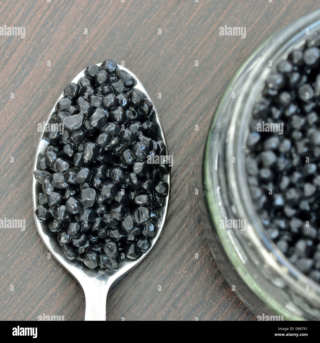 Black caviar on a spoon Stock Photo