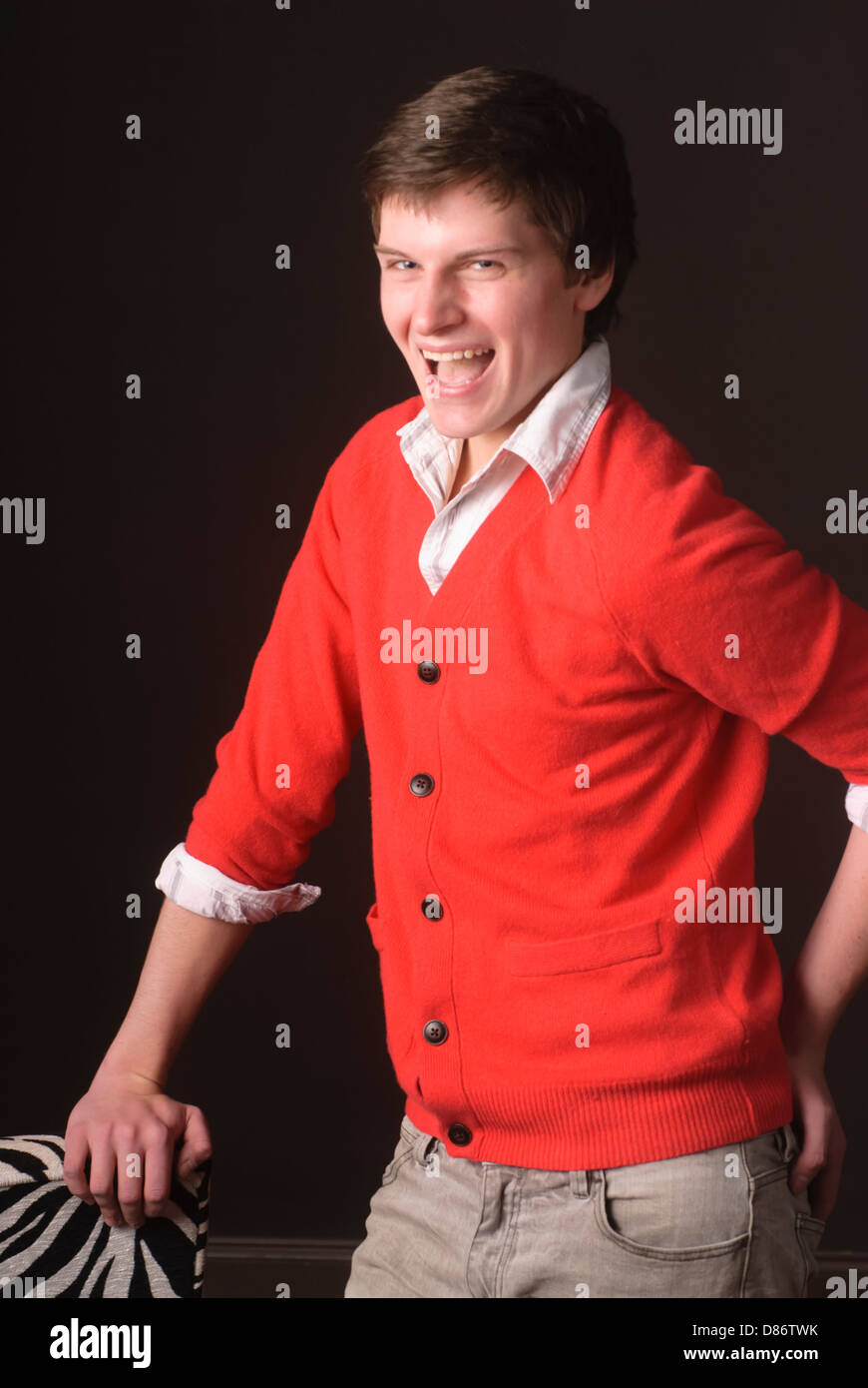 Young man posing and cutting up in studio environment Stock Photo Alamy