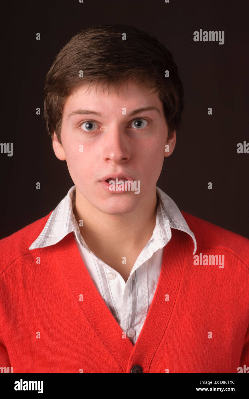 Young man posing and cutting up in studio environment Stock Photo Alamy