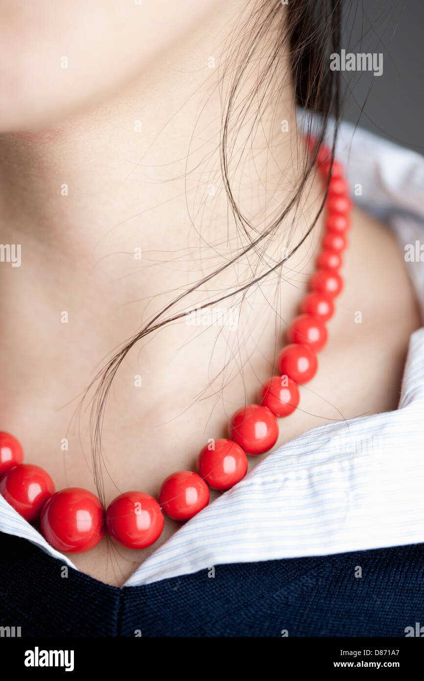 Japanese woman with red necklace, close up Stock Photo