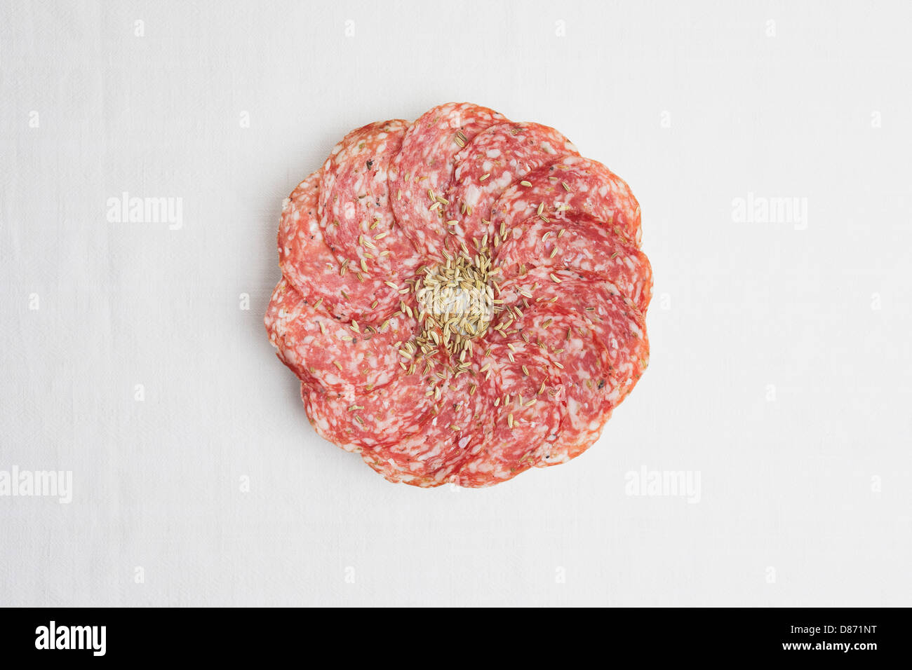 Fennel salami with seeds on white background Stock Photo Alamy