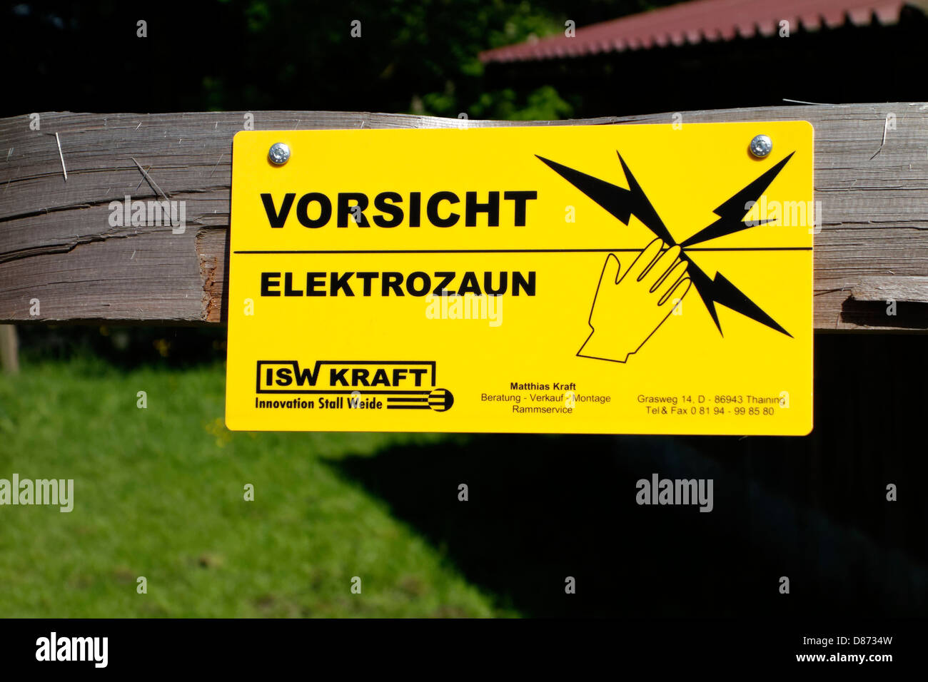German electric fence warning sign , Chiemgau, Upper Bavaria Germany Stock Photo