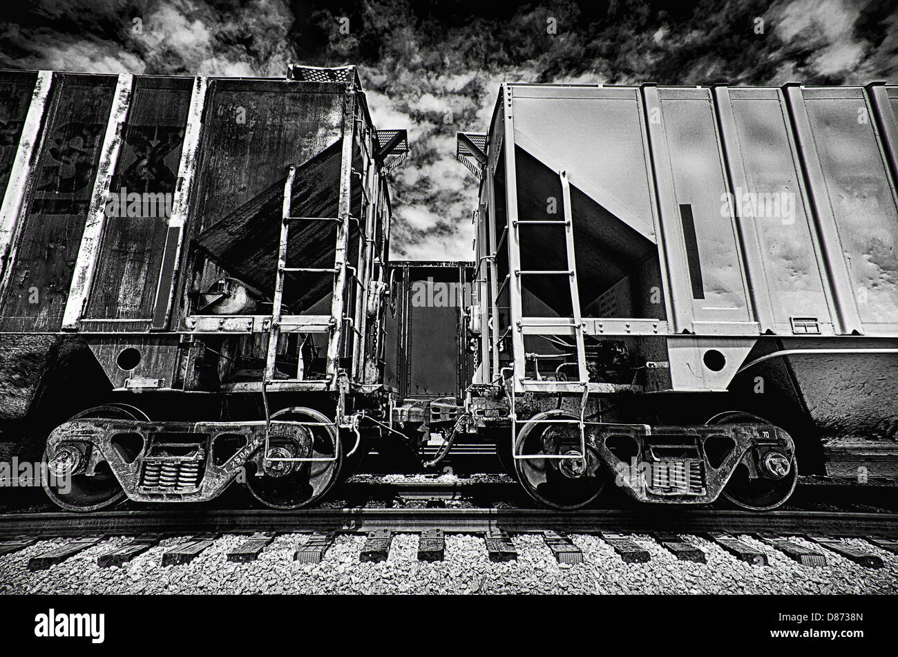 This is a black and white image of train cars coupling. Stock Photo